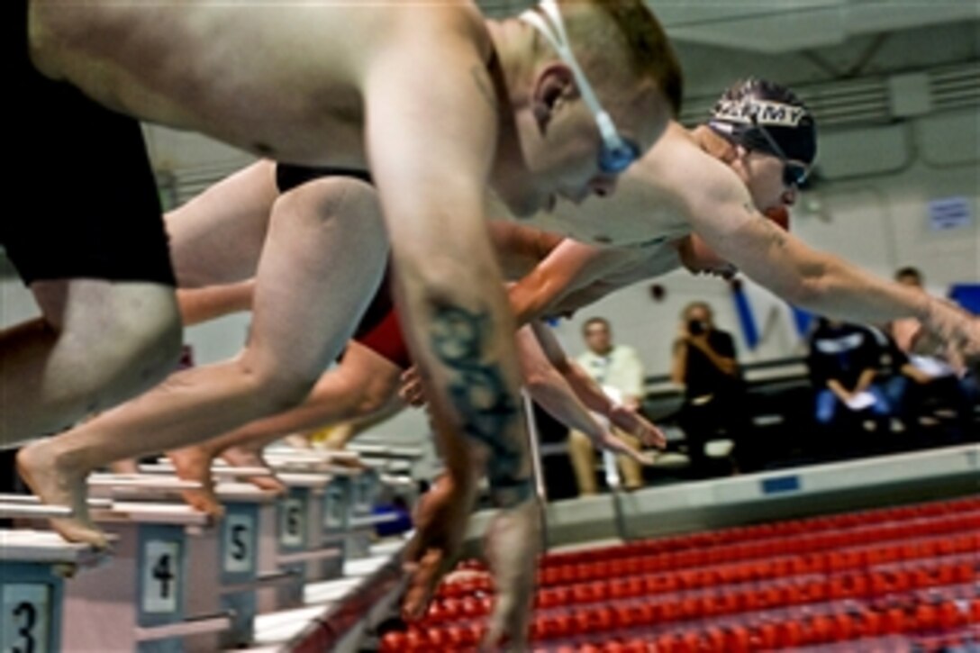 Divers compete in the 100-yard freestyle at the inaugural Warrior Games at the U.S. Olympic Training Center, Colorado Springs, Colo., May 12, 2010. The competition runs through May 14.