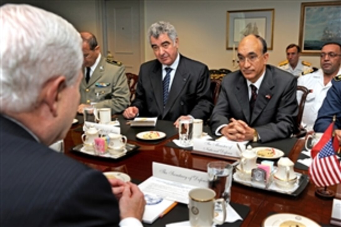 Tunisian Defense Minister Ridha Grira, right, meets with U.S. Defense Secretary Robert M. Gates, left foreground, at the Pentagon, May 13, 2010. Senior Col. Mohamed Bin Ghorbel, left, director general of international relations and cooperation, and Ambassador to the United States Habib Mansour, center, joined Grira as part of the Tunisian delegation.