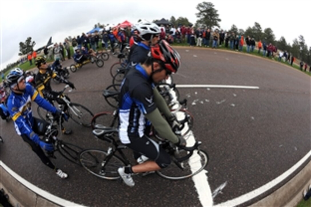 Warrior Games athletes wait for the signal to begin the 20-kilometer upright bike race for the inaugural Warrior Games May 13, 2010, at the U.S. Academy in Colorado Springs, Colo.  