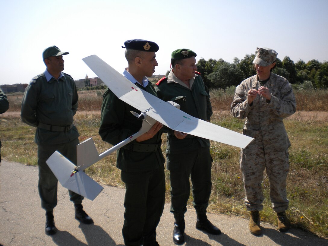 Members of the Royal Moroccan Army receive an explanation of the RAVEN unmanned aerial vehicle's capabilities from U.S. Marine Maj. Shannon C. Greene during the first intelligence staff training course here, May 13.  The course is the first of its type to be facilitated by U.S. Marine Forces Africa during an AFRICAN LION.  AFRICAN LION 2010, a combined U.S.-Moroccan exercise designed to promote interoperability and mutual understanding of each nation’s military tactics, techniques and procedures. It brings together nearly 1,000 U.S. service members from 16 locations throughout Europe and North America with more than 1,000 members of the Moroccan military.  The exercise is scheduled to end on or around June 9. All U.S. forces will return to their home bases in the United States and Europe at the conclusion of the exercise.