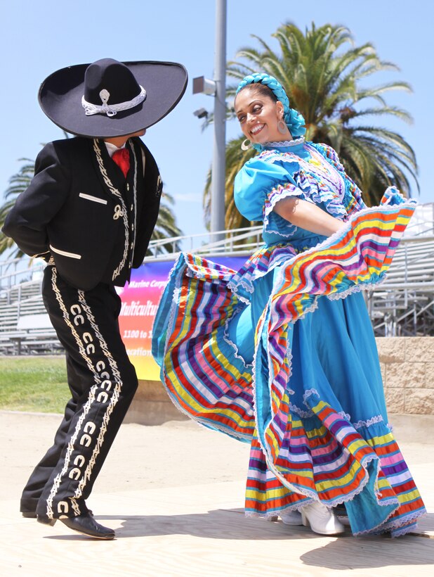 Daniel Vasquez (left), and Elizabeth Juarez, perform a traditional Mexican Ballet Folklorico Tapatio dance during Camp Pendleton’s 5th Annual Multicultural Day celebration at the 11 Area field, May 13. During the 4-hour affair, themed “Celebrate America,” local residents had the opportunity to visit more than 20 booths, filled with everything from foreign cuisines to cultural souvenirs.