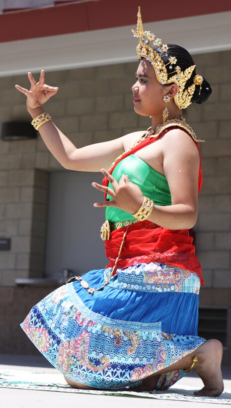 Katie Onthong, performs a traditional Srivichai Thai dance during Camp Pendleton’s 5th Annual Multicultural Day celebration at the 11 Area field, May 13. During the 4-hour affair, themed “Celebrate America,” local residents had the opportunity to visit more than 20 booths, filled with everything from foreign cuisines to cultural souvenirs.