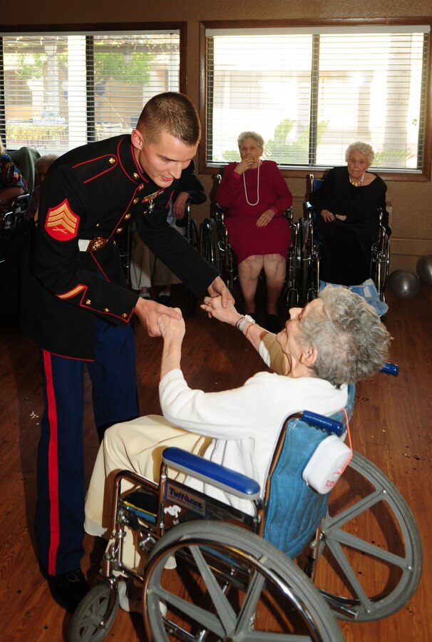 Sgt. Righard Davis, Marine Aviation Logistics Squadron 13, dances with Rosemarie Williams, 88, at the Mesa Rehabilition and Care Center ball in Yuma, Ariz., May 13, 2010. Davis and three other Yuma Marines volunteered with the Single Marine Program to dance with seniors. "It's really nice to be able to go out and show people of all ages what the Marine Corps is all about," said Davis. "I think we probably made some of those folks' night." The Marines danced and mingled with the seniors, giving them a chance to talk to the young Marines.