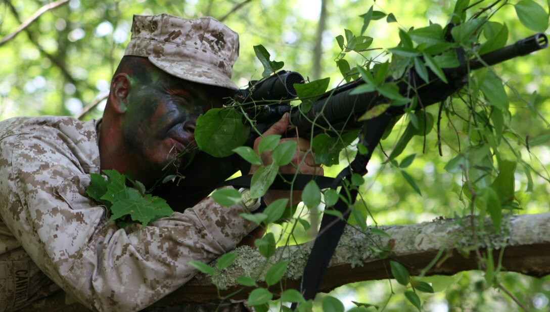 A Marine with the 2nd Marine Logistics Group posts security during a field exercise that was part of a Corporal's Course held aboard Camp Lejeune, N.C., from May 14-17, 2010.  The 2nd MLG recently initiated their own version of the Staff Noncommissioned Officer Academy's Corporal's Course to allow 2nd MLG corporals to go through the mandatory course without taking them out of their day-to-day jobs over an extended period of time.