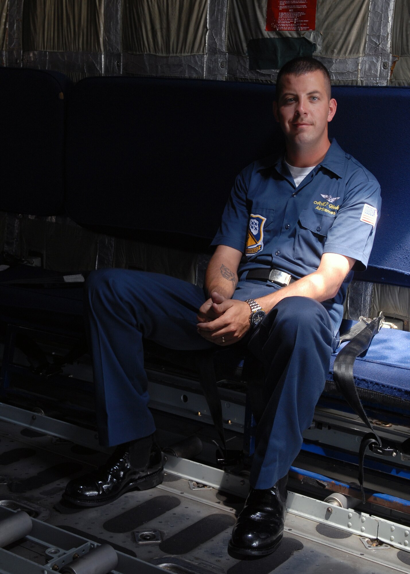 100514-N-9565D-110 JOINT BASE ANDREWS, Md. (May 14, 2010) - Aviation Structural Mechanic 2nd Class Cody Weeks, assigned to the U.S. Navy's flight demonstration team, the Blue Angels, takes a break while discussingthe flight plan of the C-130 Hercules named "Fat Albert," to members of the media prior to lift off.   This is the first Joint Service Open House conducted by Team Andrews members at the newly minted Joint Base Andrews, continuing a rich tradition of parternship and strength rooted in service to the nation.  (U.S. Navy photo by Mass Communication Specialist 2nd Class Clifford L. H. Davis)