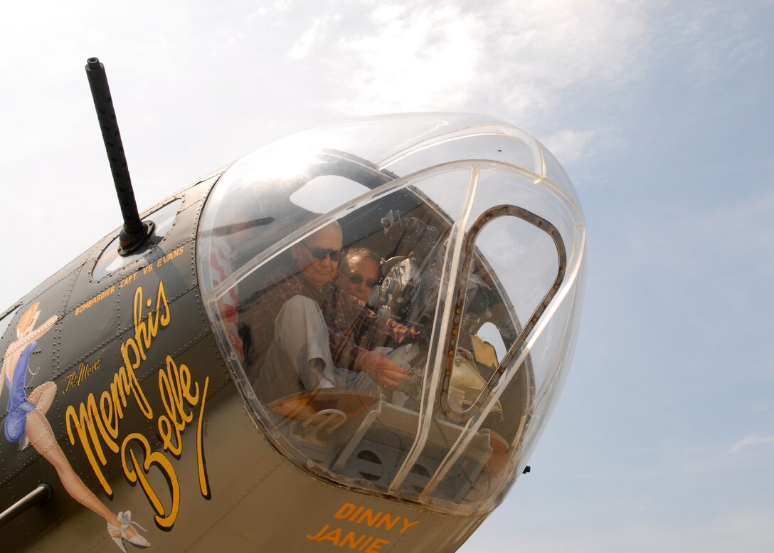 100514-N-9565D-049 JOINT BASE ANDREWS, Md. (May 14, 2010) - U.S. Army Air Corps Lt. Col. Roy Truba (Ret.), a B-17 bombardier for the 751st squadron, 351st bomb group during World War II, speaks to child aircraft enthusiast about his flying experiences during WWII in the aircraft named "Memphis Belle."  Trumba was shot down Apr. 18, 1945, and held six weeks as a POW and had not been inside a B-17 since bailing out over Germany.  This is the first Joint Service Open House conducted by Team Andrews members at the newly minted Joint Base Andrews, continuing a rich tradition of parternship and strength rooted in service to the nation.  (U.S. Navy photo by Mass Communication Specialist 2nd Class Clifford L. H. Davis)