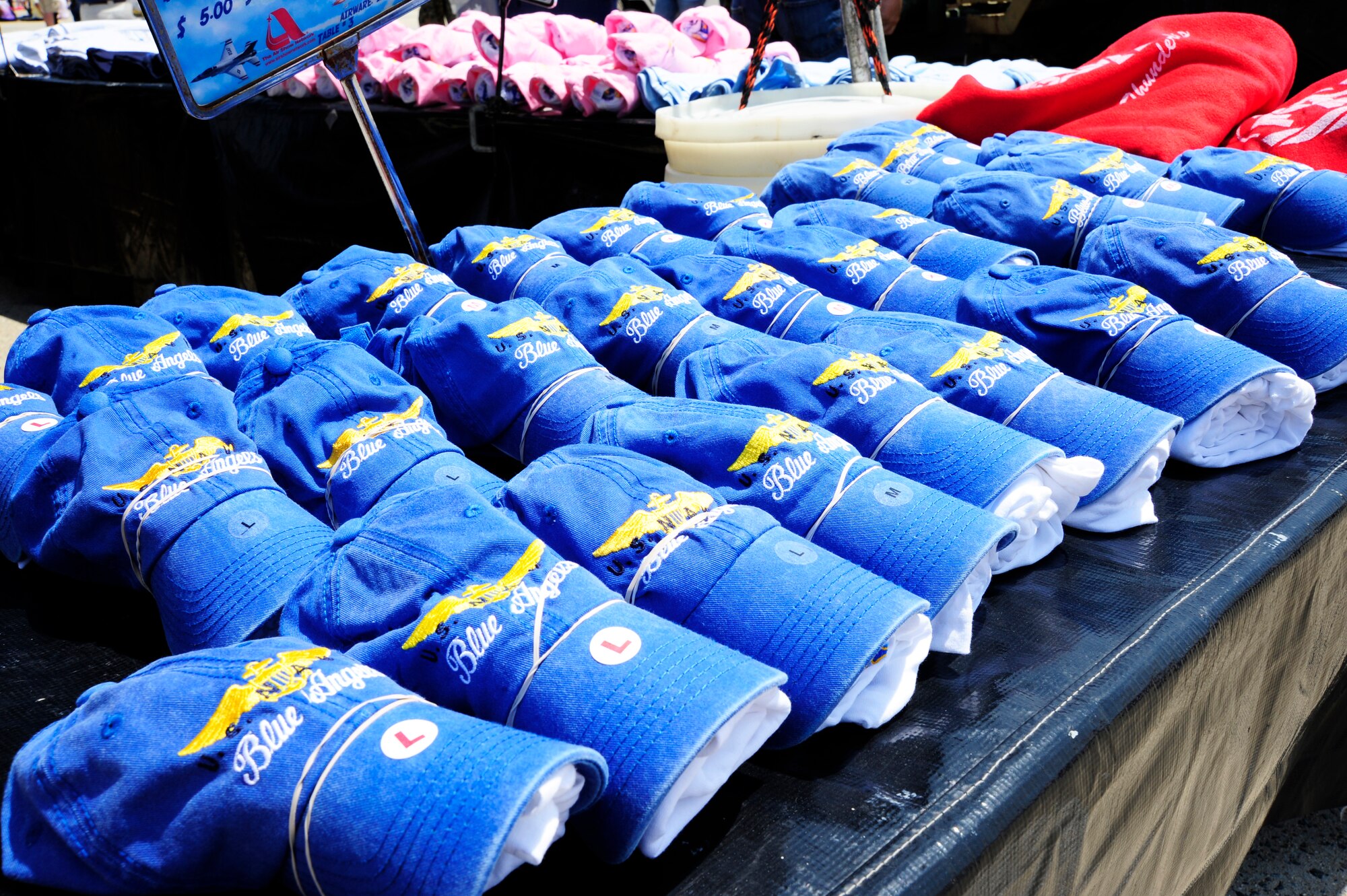 JOINT BASE ANDREWS, Md. - Vendors sell U.S. Navy Blue Angels gear during the 2010 Joint Service Open House May 14 here. The Blue Angels are the headliners for this year's air show, one of 68 planned for the year. JSOH offers a great opportunity for all members of the joint service community and the public to interact. (U.S. Air Force photo by Staff Sgt Keyonna Fennell)