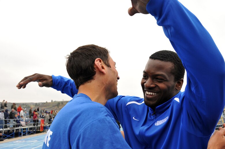 Air Force team member Matt Sanders (right) hugs teammate Adam Tanverdi after he completed his track event during the Warrior Games at the U.S. Air Force Academy track in Colorado Springs, Colo., May 14, 2010. (U.S. Air Force photo/Staff Sgt. Desiree N. Palacios)