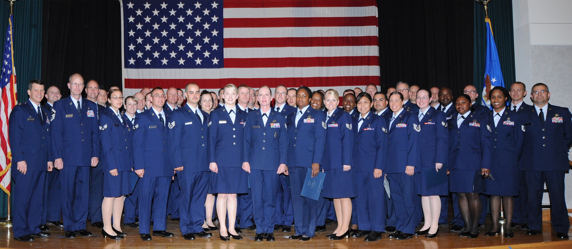 More than 50 Team McConnell Airmen received their Community College of the Air Force degree from Col James Crowhurst, 22nd Air Refueling Wing commander during a ceremony, May 14, 2010, at the Dole Community Center, McConnell Air Force Base, Kan.  The Community College of the Air Force has awarded more than 350,000 degrees since it began in 1977.  More than 70 percent of Air Force enlisted personnel have some college and more than 24 percent have an associate's degree or higher. (U.S. Air Force photo/Tech. Sgt. Chyrece Campbell)