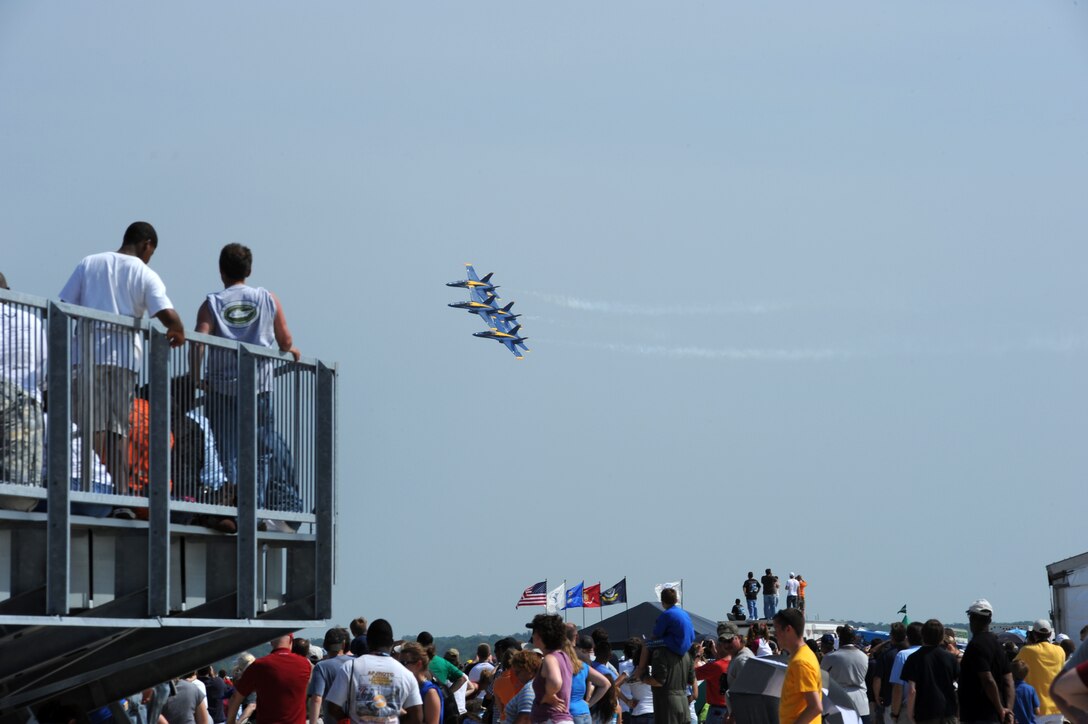 Joint Base Andrews, Md. -- Spectators watch as the Blue Angels perform at the 2010 Joint Service Open House here May 14. This year the Blue Angels will perform approximately 68 shows at 35 locations for more than eight million spectators. JSOH offers an opportunity for the public to see military equipment from the Navy, Marines, Army, Air Force, and Coast Guard. (U.S. Air Force photo by Staff Sgt Melissa Stonecipher)