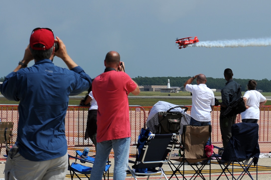 Joint Base Andrews, Md. -- The crowd watches the sky as “The Oracle” performs stunts at the 2010 Joint Service Open House here May 14. This year’s event will have demonstrations by the Navy Blue Angels and the Army Golden Knights. JSOH is planned and conducted by Total Force; Active, Guard, Reserve, Civilian employees, as well as retirees and families. (U.S. Air Force photo by Staff Sgt Melissa Stonecipher)