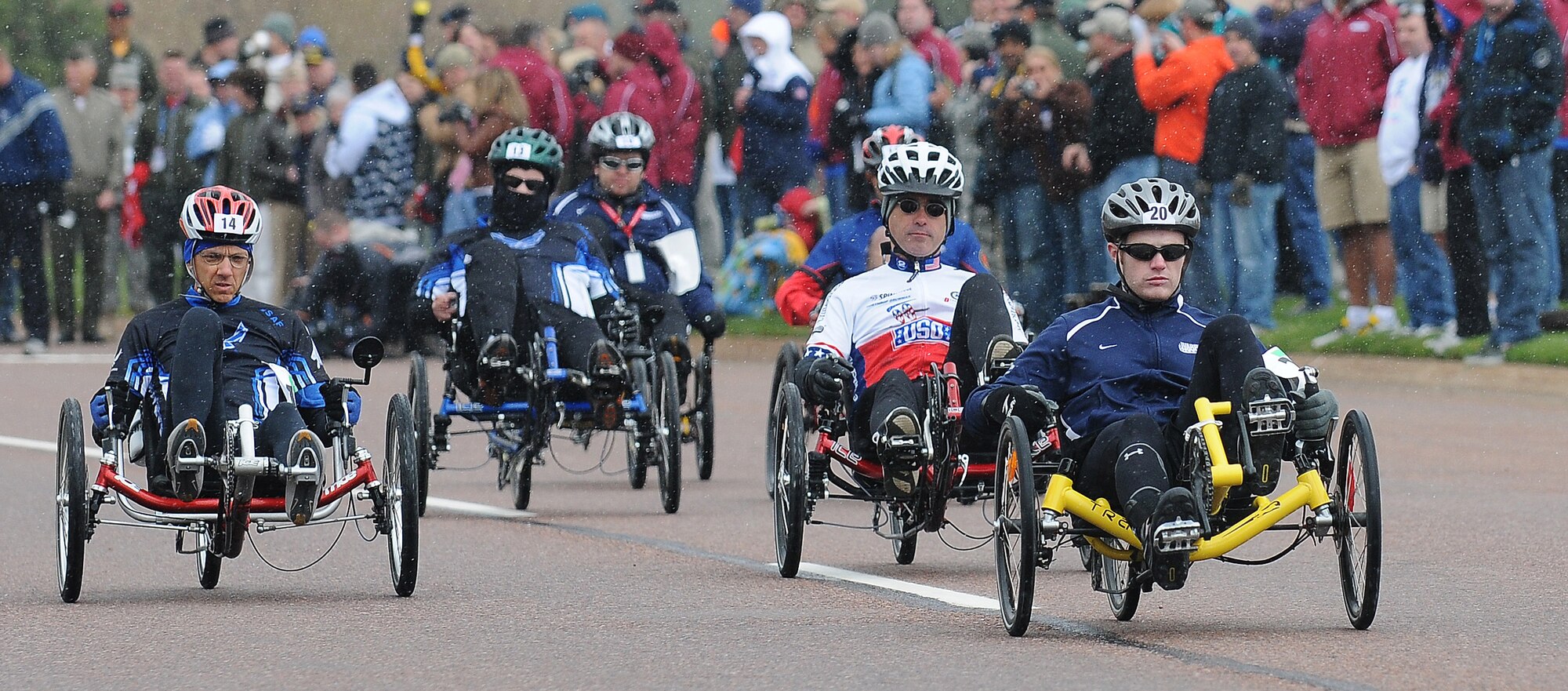 Mike Bell of the Coast Guard and Senior Master Sgt. Michael Sanders of the Air Force lead the pack during the Warrior Games' recumbent bicycle 10k May 13, 2010, at the Air Force Academy in Colorado Springs, Colo. Sanders smoked the competition, finishing in 24:03 to win gold. The Marines' Angel Gomes took silver with 30:07, and Bell earned the bronze with a time of 30:08. (U.S. Air Force photo/Rachel Boettcher)