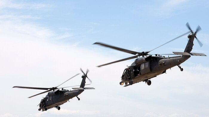 NELLIS AIR FORCE BASE, Nev. -- A 2-ship of HH-60G Pavehawks head to the Nevada Test and Training Range for an exercise, May 13. The primary mission of the 66th Rescue Squadron is to provide rapidly deployable, expeditionary combat search and rescue forces to theater commanders in response to contingency operations worldwide. The 66th RQS is one of only six Air Force active-duty combat rescue units flying the HH-60G Pavehawk helicopter. Depending on the mission, a typical rescue crew includes a pilot, co-pilot, flight engineer, gunner and two pararescuemen.(U.S. Air Force Photo by Airman 1st Class Brett Clashman/RELEASED)