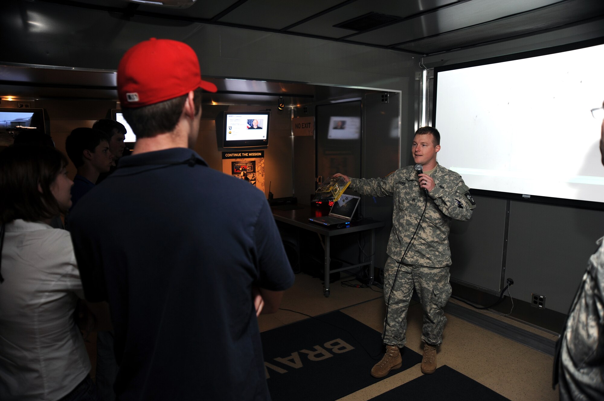 JOINT BASE ANDREWS, Md. –Army Staff Sgt. Matthew Zedwick, 2-162 Infantry, Oregon National Guard, gives a briefing to guests who have completed the Virtual Army Experience during the Joint Service Open House here May 14.  Zedwick was awarded the Silver Star for his actions during his most recent Iraq deployment.  JSOH allows members of the public an excellent opportunity to meet and interact with the men and women of the Armed Forces and to show them America’s skilled military. (U.S. Air force photo by Staff Sgt. Christopher A. Marasky)