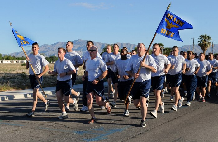 NELLIS AIR FORCE BASE, Nev. -- Members of the 99th Security Forces Group perform cadence while running in the 99th Air Base Wing military formation run, May 14. The 1.5 mile run was lead by Col. Steven Garland, 99th Air Base Wing Commander.  (U.S Air Force Photo / Senior Airman Stephanie Rubi)