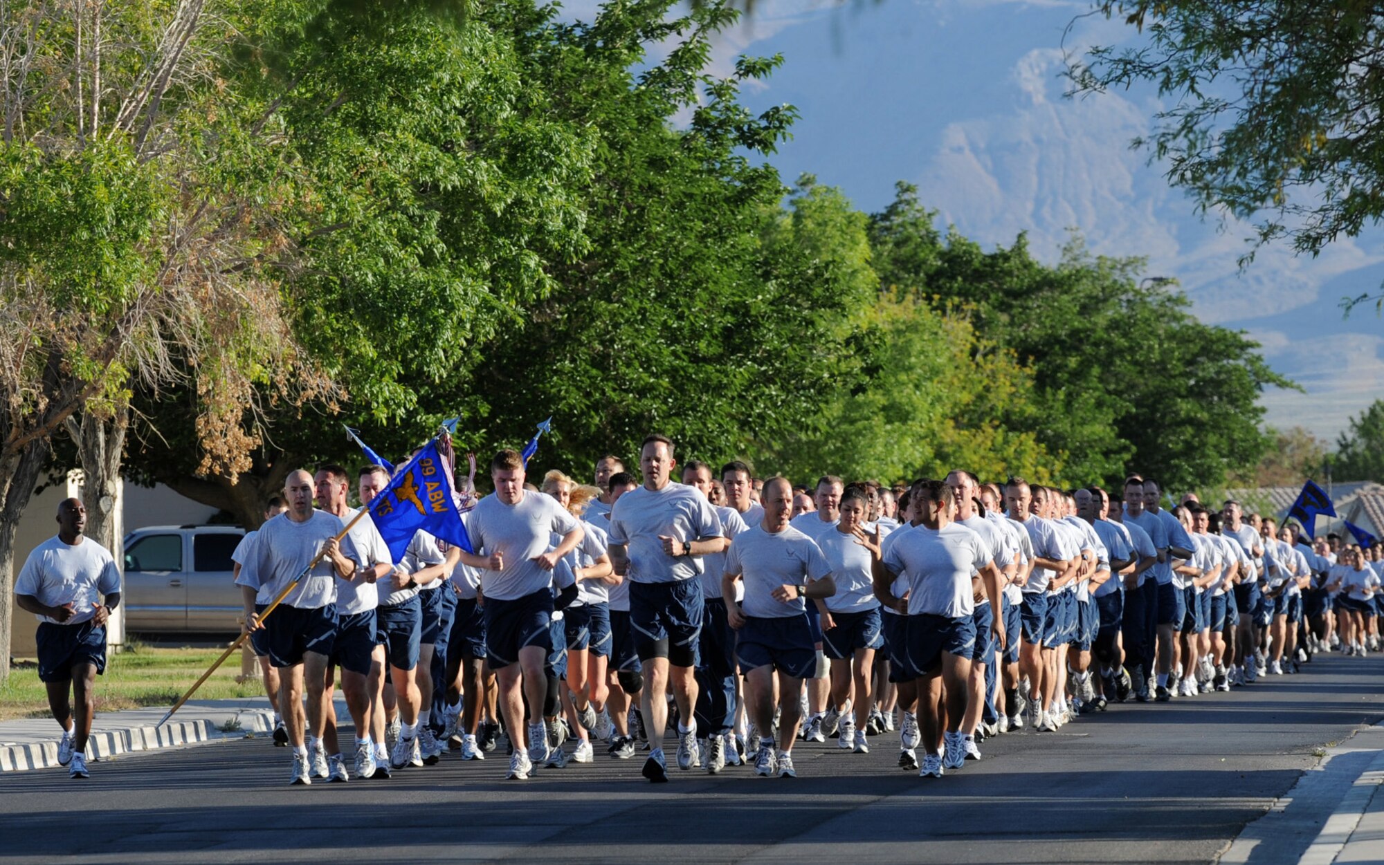 NELLIS AIR FORCE BASE, Nev. -- Col. Steven Garland, 99th Air Base Wing commander, leads members of the 99th Air Base Wing through a 1.5 mile run, May 14. The run was coordinated to help raise moral and unit comradery within the wing.  (U.S Air Force Photo / Senior Airman Stephanie Rubi)