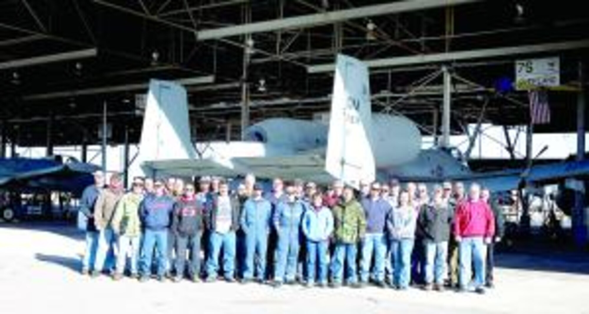 The 309th A-10 Speedline Team assembles in front of an A-10 for a group photo. The team won an Air Force Materiel Command production award. (U.S. Air Force photo by Terry Pittman)