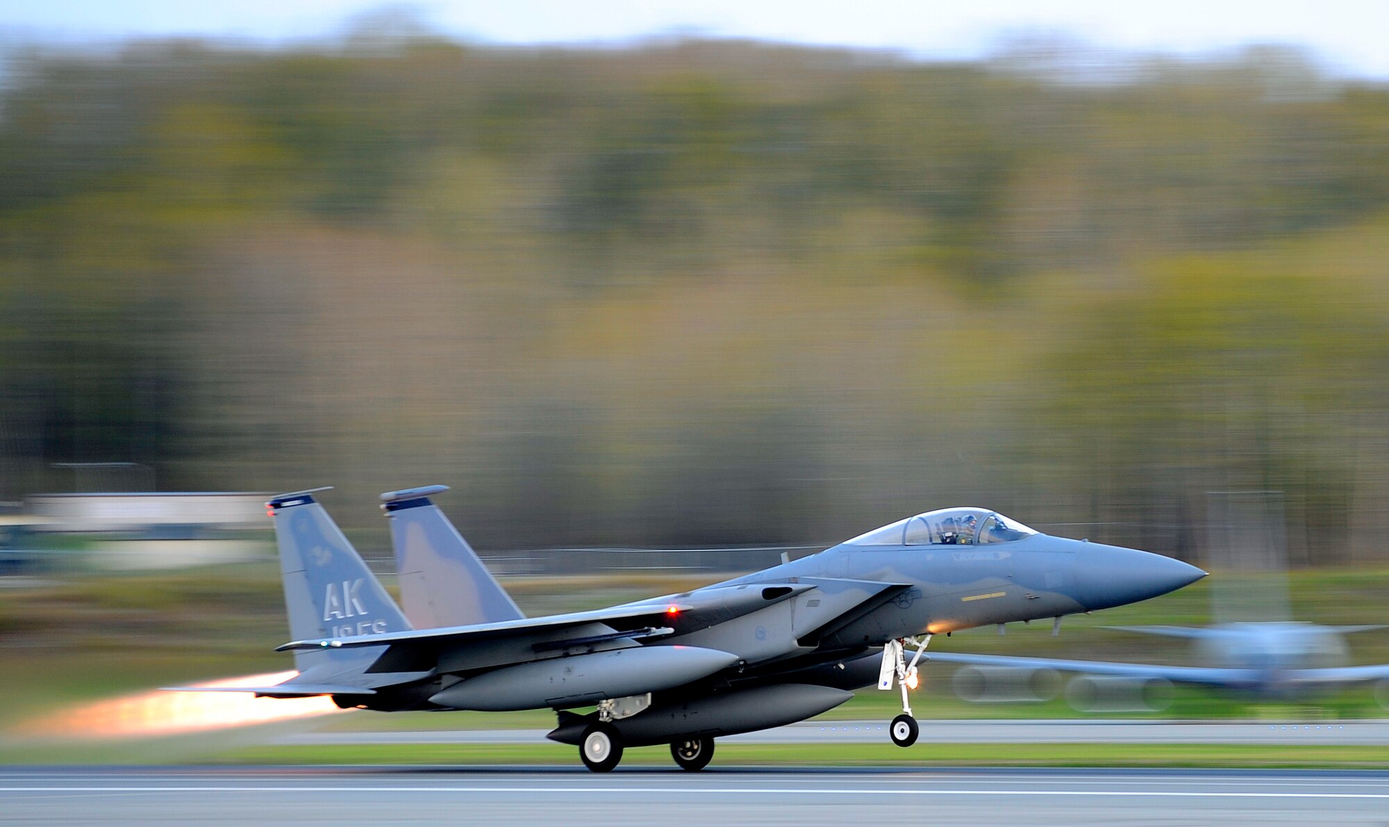 The 19th Fighter Squadron's F-15 Eagle flagship takes off for the final time at Elmendorf Air Force Base, Alaska, May 13. The aircraft is going to the depot at Robins Air Force Base, Ga., for refurbishing then reassignment.  (Air Force photo by Staff Sgt. Brian Ferguson)