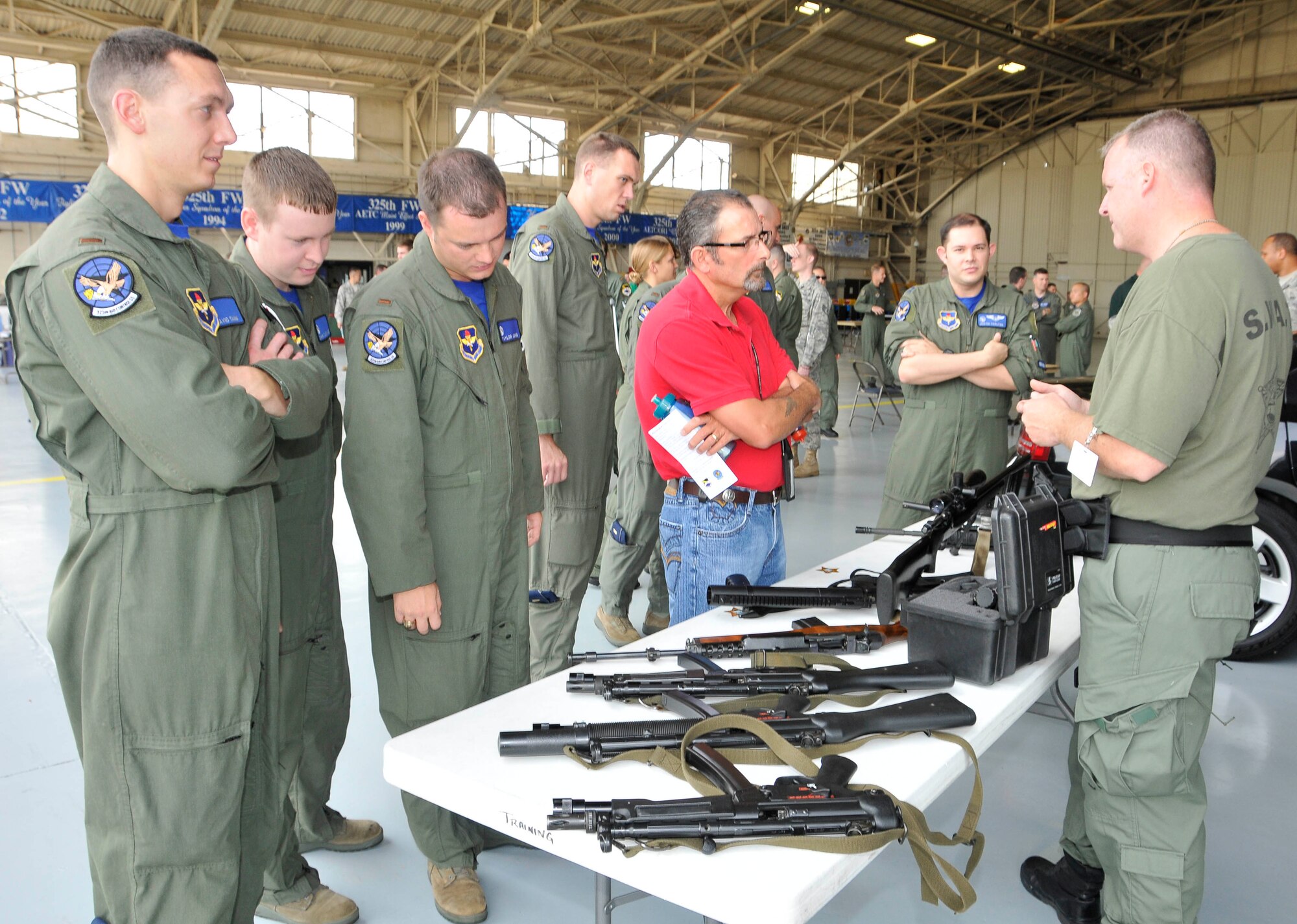 A Bay County Special Weapons and Tactics member educates Airmen May 14 at the Safety Day Fair in Hangar One. (U.S. Air Force photo by Lisa Norman)