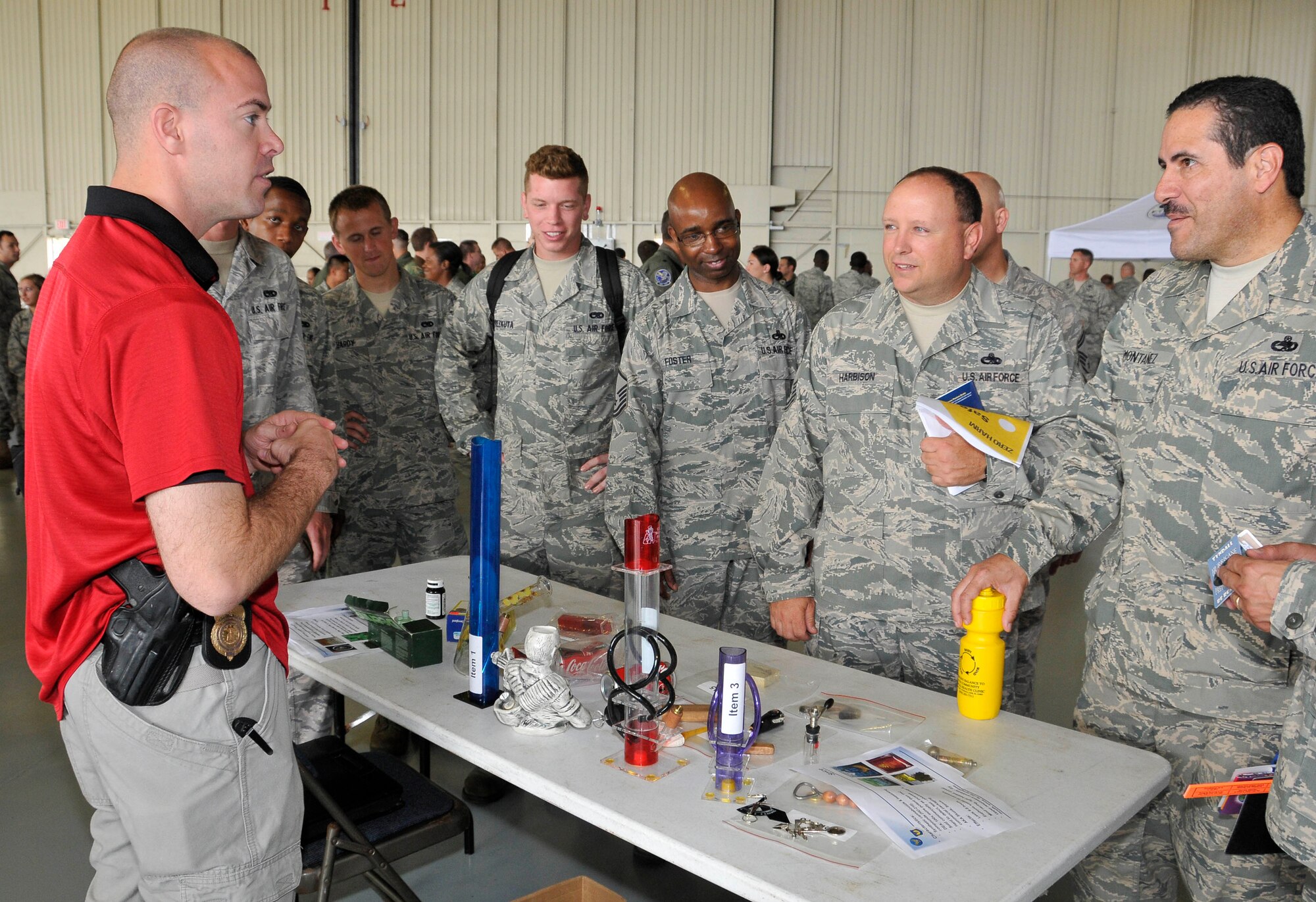 The Office of Special Investigations educates Airmen May 14 at the Safety Day Fair in Hangar One. (U.S. Air Force photo by Lisa Norman)