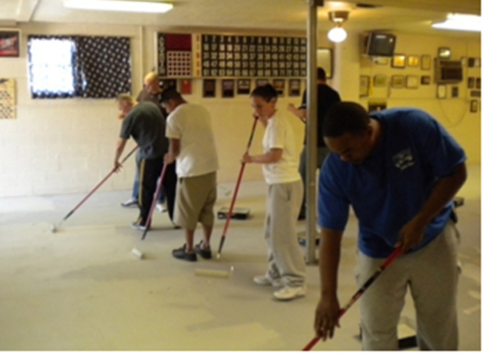 Junior Enlisted Team Sheppard members paint the bingo floor at the local Veterans of Foreign Wars Chapter 8878 in Wichita Falls, Texas, May 8, 2010. Twenty-one JETS members volunteered more than 160 hours. The JETS council meets the second Tuesday of each month and is open to E-6s and below from all branches of service. (U.S. Air Force photo/Staff Sgt. Justin Kappenman)