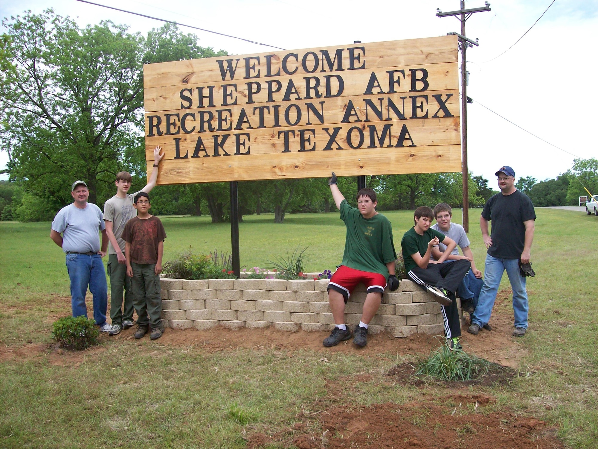 An Eagle Scout project, led by David Lipsey, Air Force dependant, installed a Welcome sign for the Sheppard Lake Texoma Recreation Annex in Wichita Falls, Texas, May 1, 2010. The annex will undergo renovations in 2012 to its marina and was awarded $785,000 for the repairs. (U.S. Air Force courtesy photo)