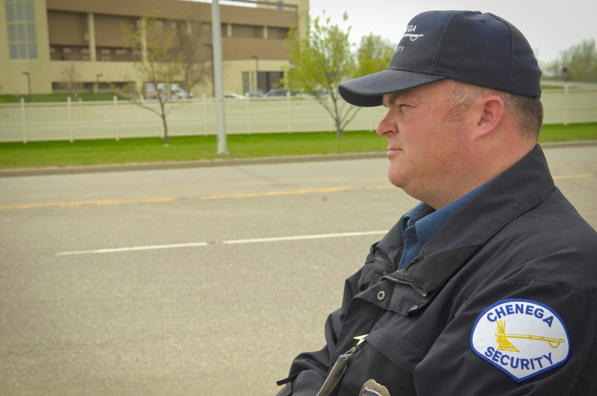 MINOT AIR FORCE BASE, N.D. -- Trent Bruns, Chenega Security security officer contracted with the 5th Security Forces Squadron, ensures the safe passage of motor vehicle traffic through the Magic City Gate here May 13. Base security is paramount for the success of both the 91st Missile Wing and 5th Bomb Wing’s missions. (U.S. Air Force photo by Senior Airman Benjamin Stratton)