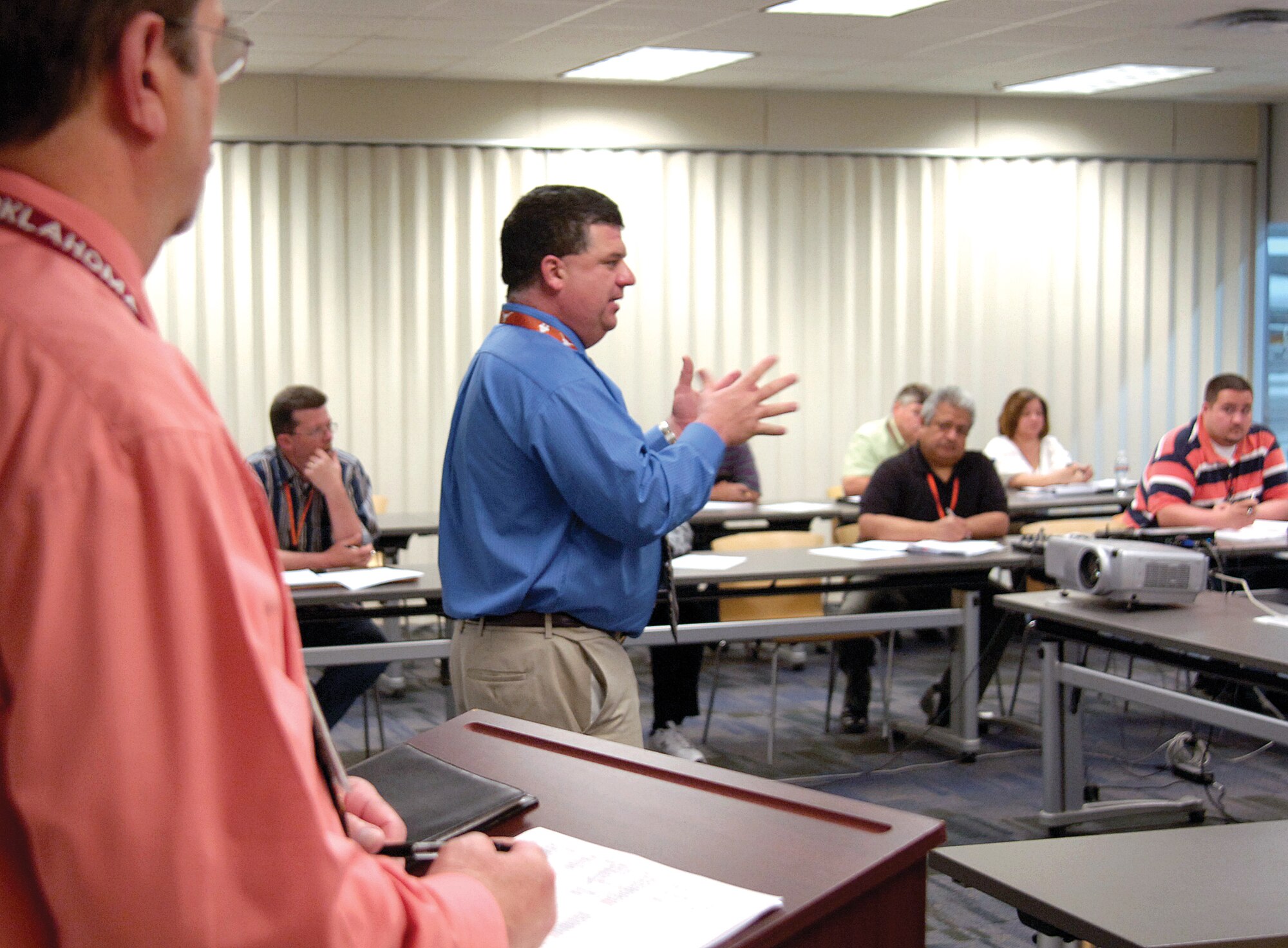Russ Knox leads a discussion about the progress of integrating laptop computers onto the production floor during a recent meeting held in the depot area of Bldg. 3001.  Approximately 30 people from a wide range of organizations meet to check the progress of implementing a transition from mechanics using paper technical orders to having them at their side on laptops. (Air Force photo by Margo Wright)