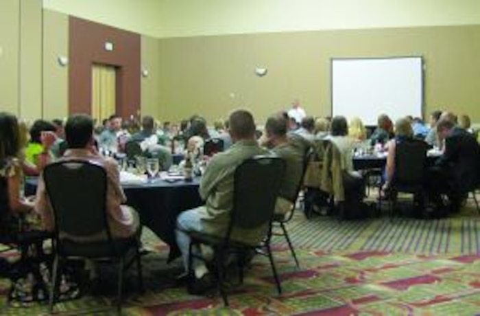 Those gathered at the 421st Fighter Squadron reunion banquet listen to the keynote speaker.