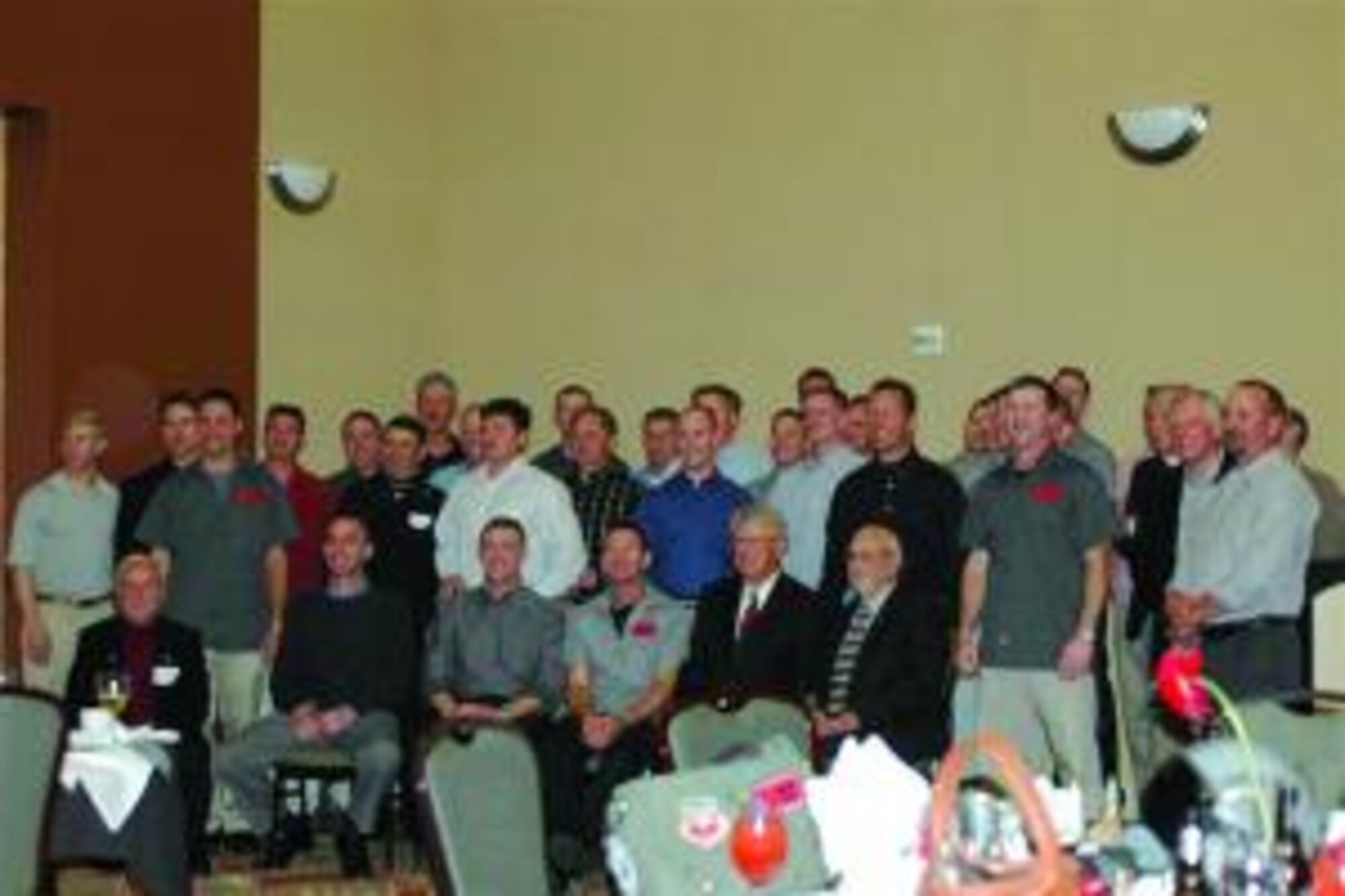 421st Fighter Squadron members, past and present, assemble for a group photo at the reunion May 8.