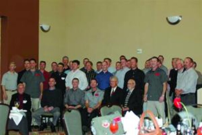 421st Fighter Squadron members, past and present, assemble for a group photo at the reunion May 8.