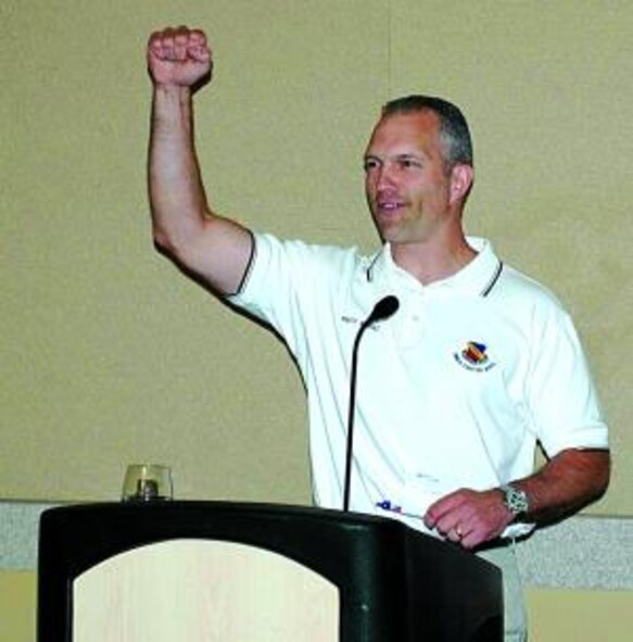 Chief Master Sgt. Marty Klukas, command chief of the Air Combat Command, cheers on those present at the 421st Fighter Squadron reunion banquet May 8 at Davis County Convention Center in Layton.