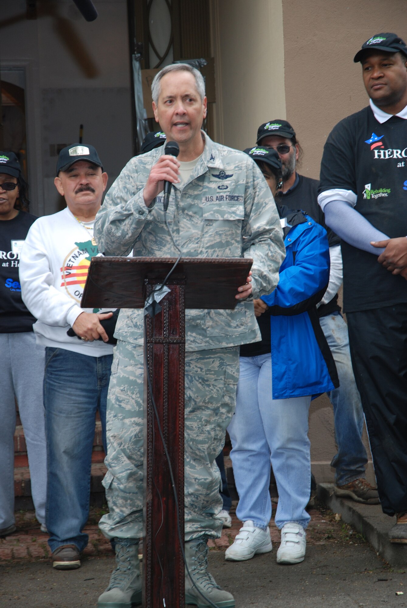 Colonel Robert Swain, 439th Airlift Wing commander, addresses volunteers at the May 12 remodeling project.  Airmen from the 439th Airlift Wing and the 104th Fighter Wing volunteer their time at a twelve-person transitional house for veterans in need.  