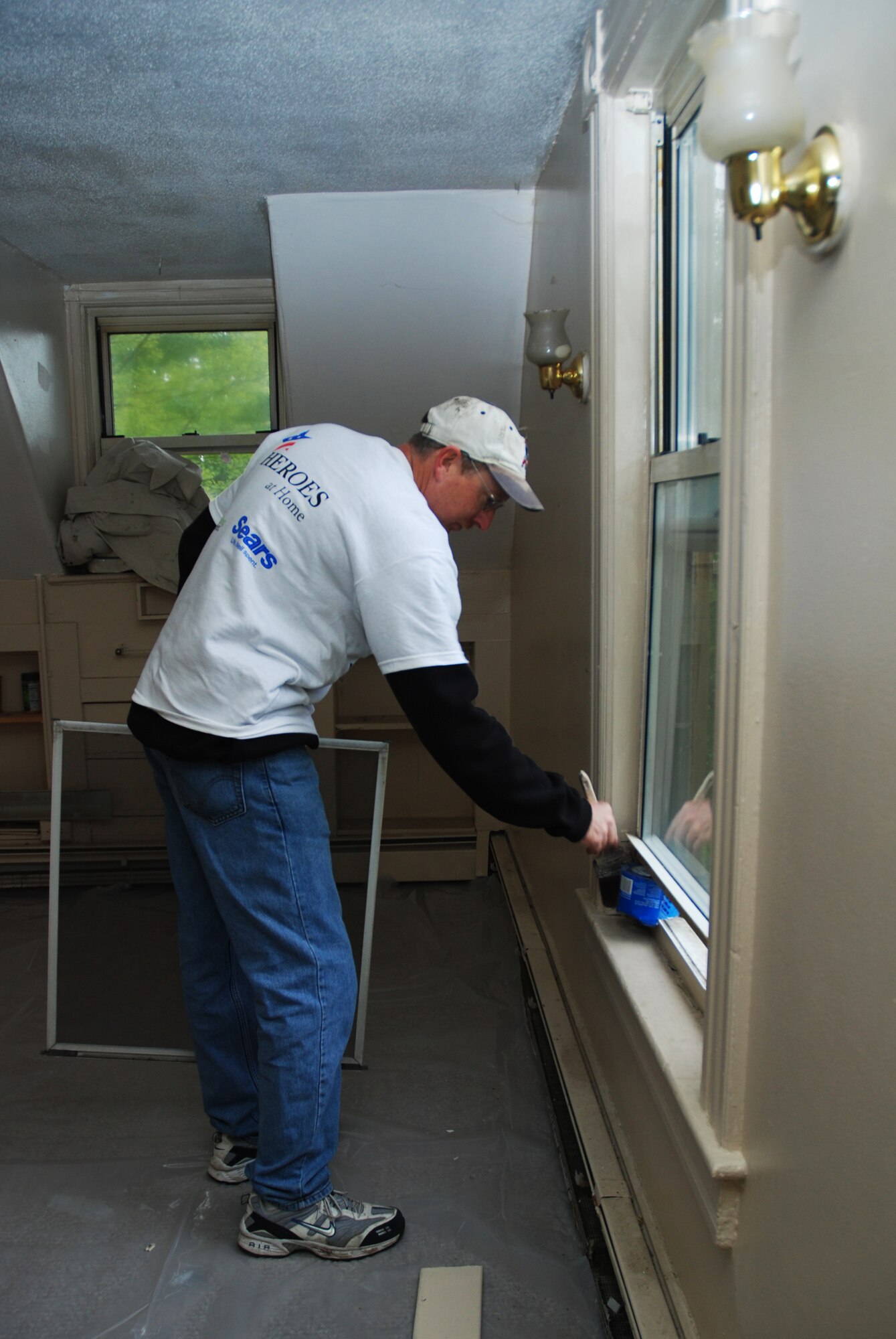 Master Sgt. Arthur Needham, 439th Aircraft Maintenance Squadron, volunteered his time at a 12-person transitional housing unit for veterans.  Airmen from the 439th Airlift Wing and the 104th Fighter Wing teamed up with Rebuilding Together in Springfield to do the one-day home make-over. 