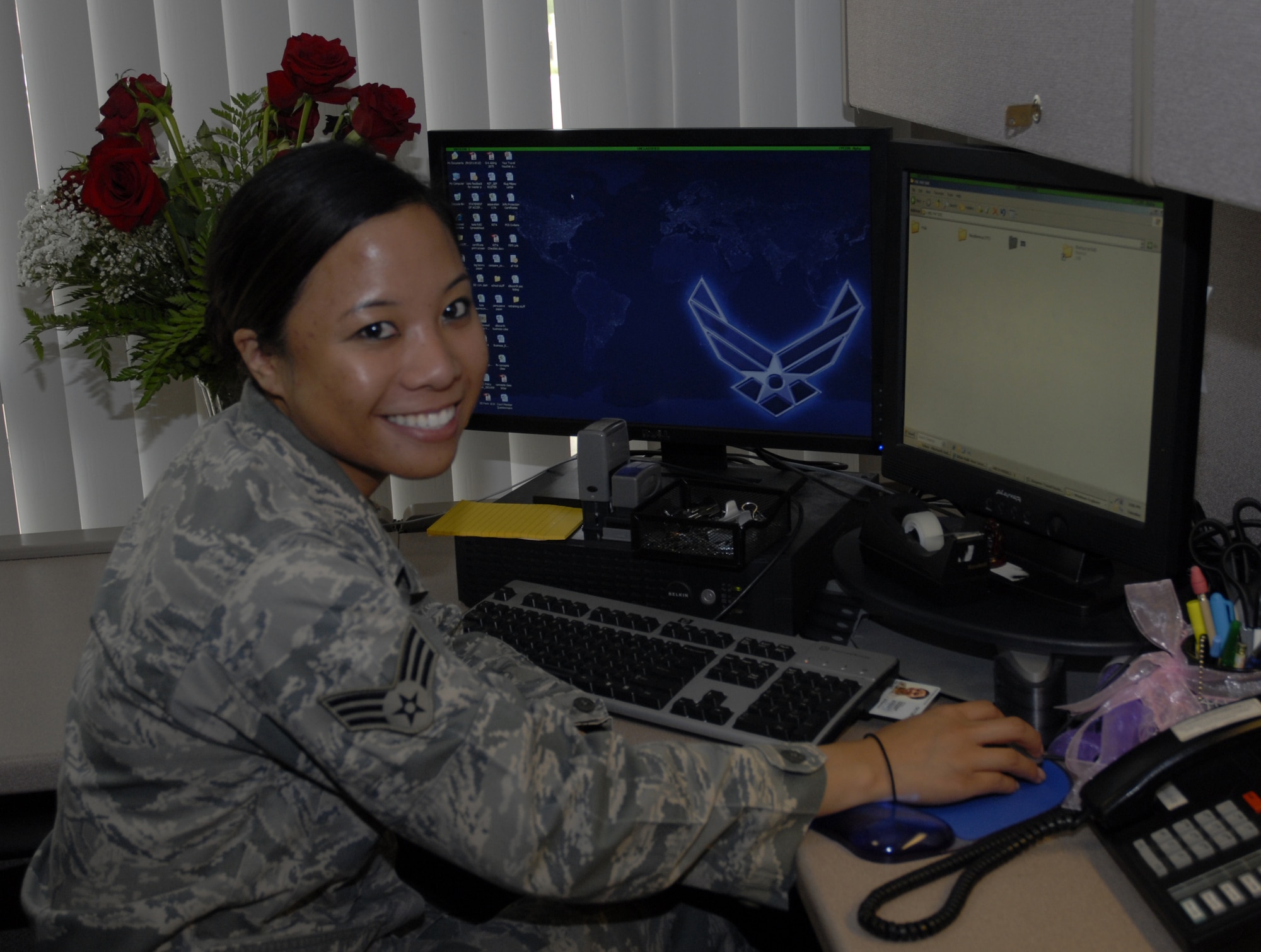Senior Airman Kathleen Abling, 1st Special Operations Comptroller Squadron finance customer service technician, sits at her desk in the finance section of the 1st Special Operations Wing headquarters building at Hurlburt Field, Fla., May 11, 2010. Airman Abling was selected for this week's "Tip of the Spear" spotlight. (DoD photo by U.S. Air Force Airman 1st Class Joe McFadden)