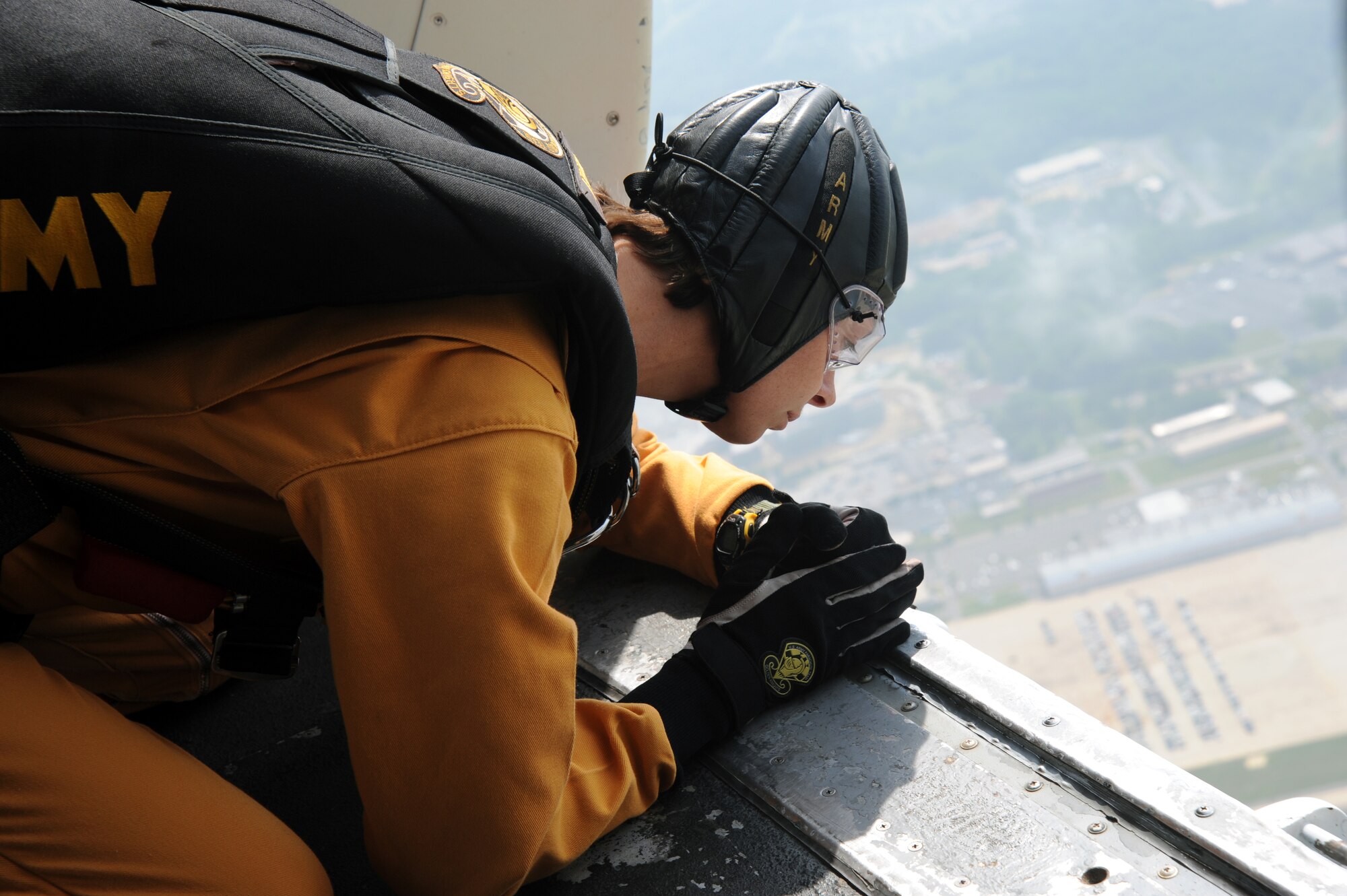 JOINT BASE ANDREWS, Md. – Army Sgt. Rachel Medley, Army Golden Knight, scouts the landing target and directs instructions to the team before a tandem jump during the Joint Service Open House here May 14.  JSOH allows members of the public an excellent opportunity to meet and interact with the men and women of the Armed Forces and to show them America’s skilled military. (U.S. Air Force photo by Staff Sgt. Christopher A. Marasky)