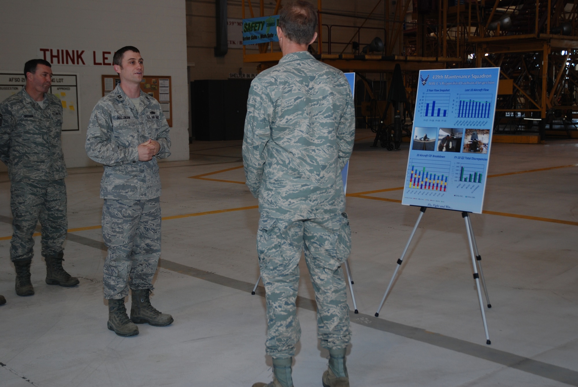 Captain Robert Dossman, 439th Maintenance Squadron, briefs Maj. Gen. James T. Rubeor, the 22nd Air Force commander, on the recent improvements in processes made by Westover maintainers.  The general visited Westover May 12 and 13.