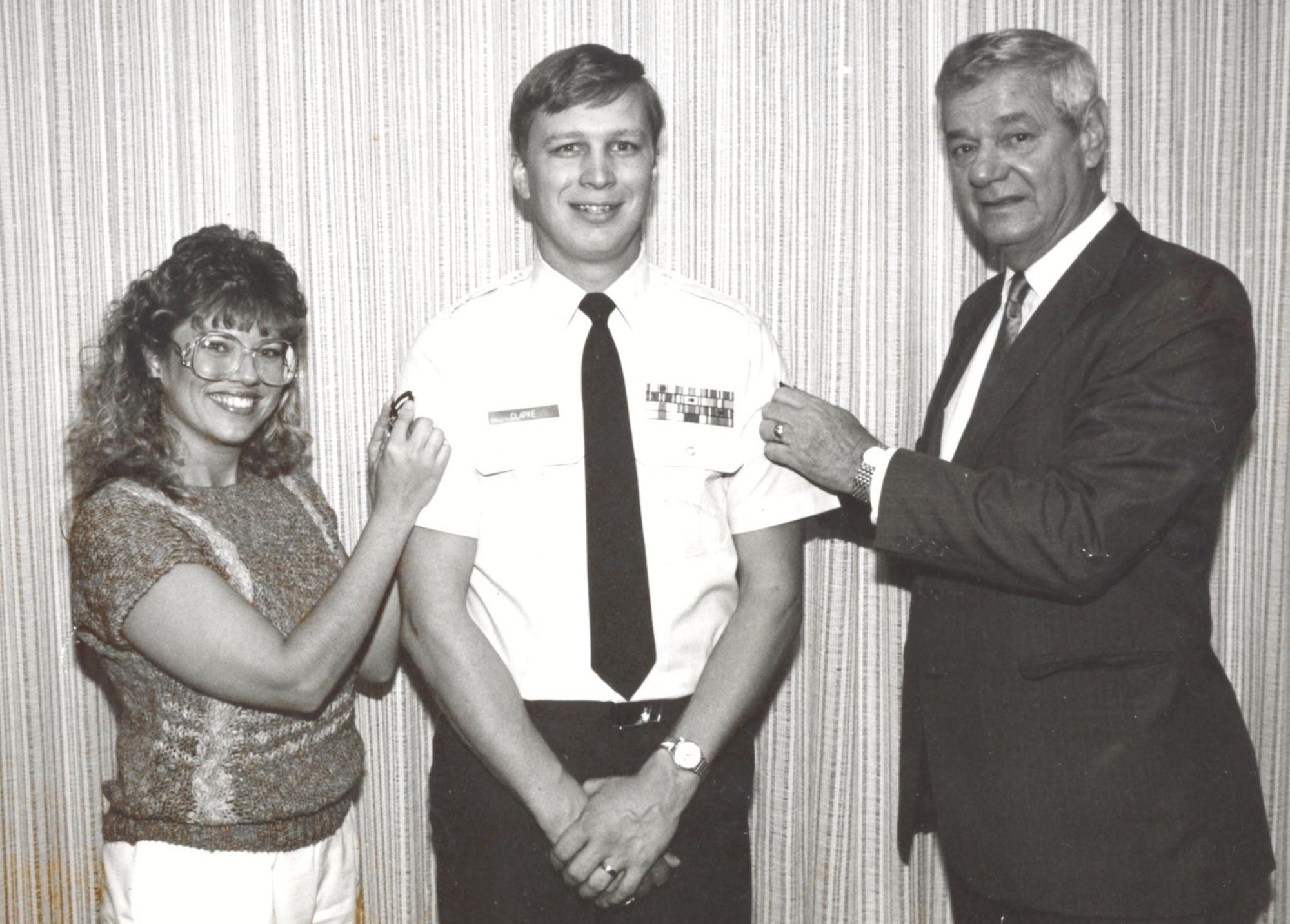 The first Chief Master Sergeant of the Air Force, Paul Wesley Airey, and Pam Clarke promote Vance Clarke to the rank of Technical Sergeant in October 1987. Now Chief Master Sgt. Clarke, Air Force Recruiting Service command chief, retires from the Air Force May 14, after 30 years of service. (Courtesy Photo)