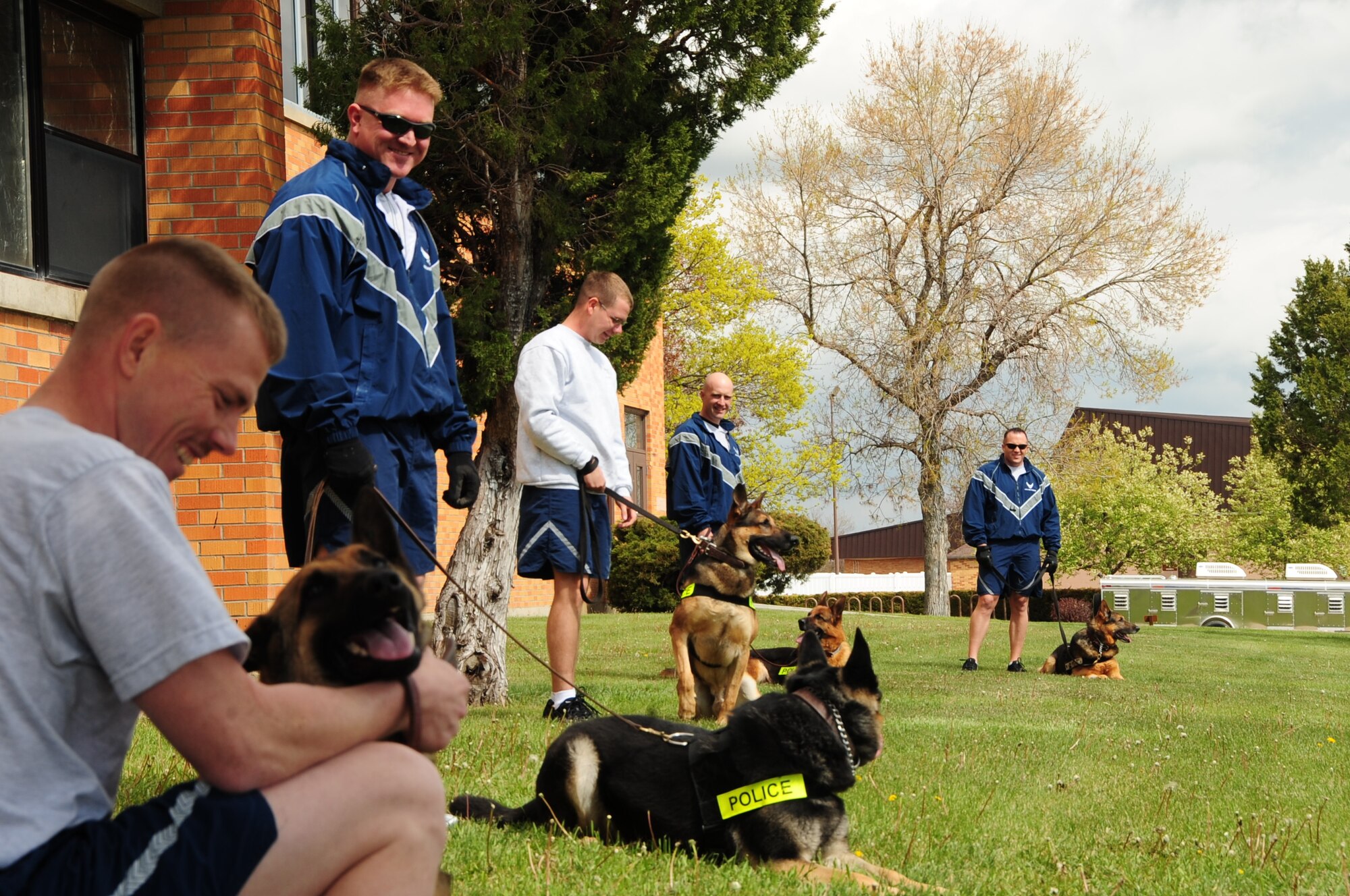 ELLSWORTH AIR FORCE BASE, S.D. -- Airmen and their military working dogs from the 28th Security Forces Squadron K-9 unit get ready for a 5K run during National Police Week, May 13.  There was a total of 38 individuals who participated in the 5K run. (U.S. Air Force photo/Airman 1st Class Anthony Sanchelli)