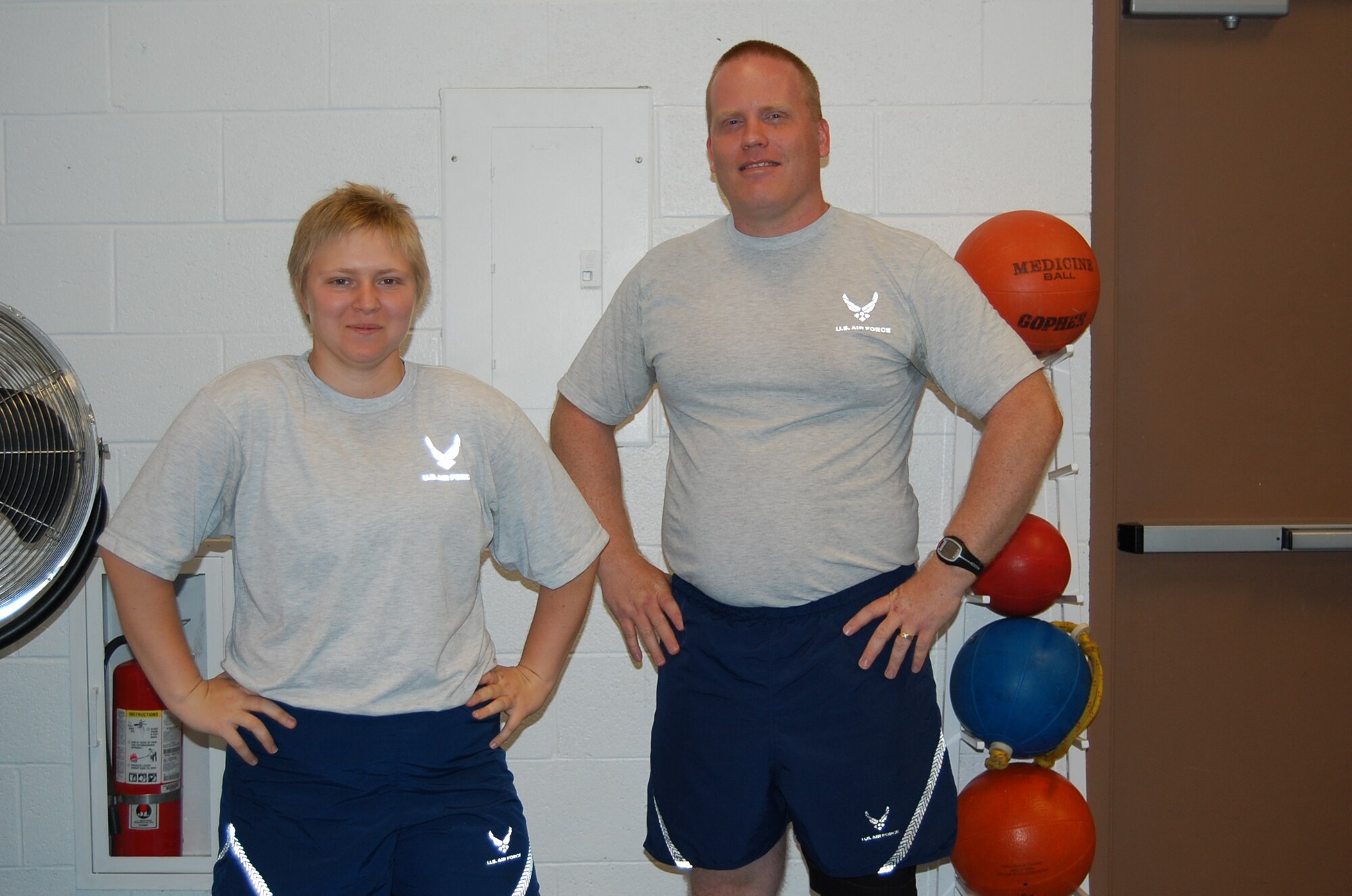 Staff Sgt. Amanda Jordan, 355th Logistics Readiness Squadron, and Tech. Sgt. David Hanneman, 355th Aircraft Maintenance Squadron, pose before a fitness session with Nerissa Atkisson, May 7, 2010, as part of the Health and Wellness Center’s Healthy Heroes program, a 90-day program geared at developing healthy lifestyle habits. The sergeants have lost a combined total of 28 pounds through the program, which began April 19. (U.S. Air Force/2nd Lt. Sarah Godfrey)