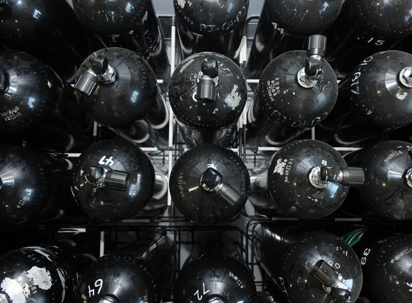MOODY AIR FORCE BASE, Ga. -- Scuba tanks are lined up for use at the 38th Rescue Squadron logistics flight maritime operations section here May 12. The scuba tanks are used for inflating portable watercrafts and also for open-ocean search and rescue missions when scuba diving is necessary. (U.S. Air Force photo by Airman 1st Class Benjamin Wiseman/RELEASED)