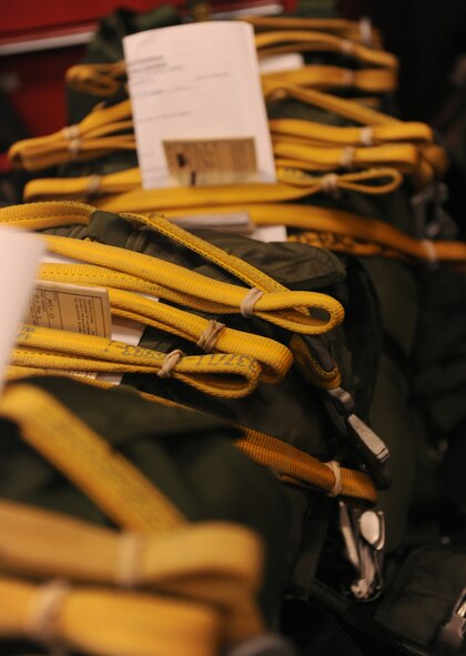 MOODY AIR FORCE BASE, Ga. -- Special operations vector parachutes wait to be inspected by 38th Rescue Squadron logistics flight aircrew flight equipment personnel here May 10. The AFE section packs and inspects nearly 20 parachutes daily. (U.S. Air Force photo by Airman 1st Class Benjamin Wiseman/RELEASED)
