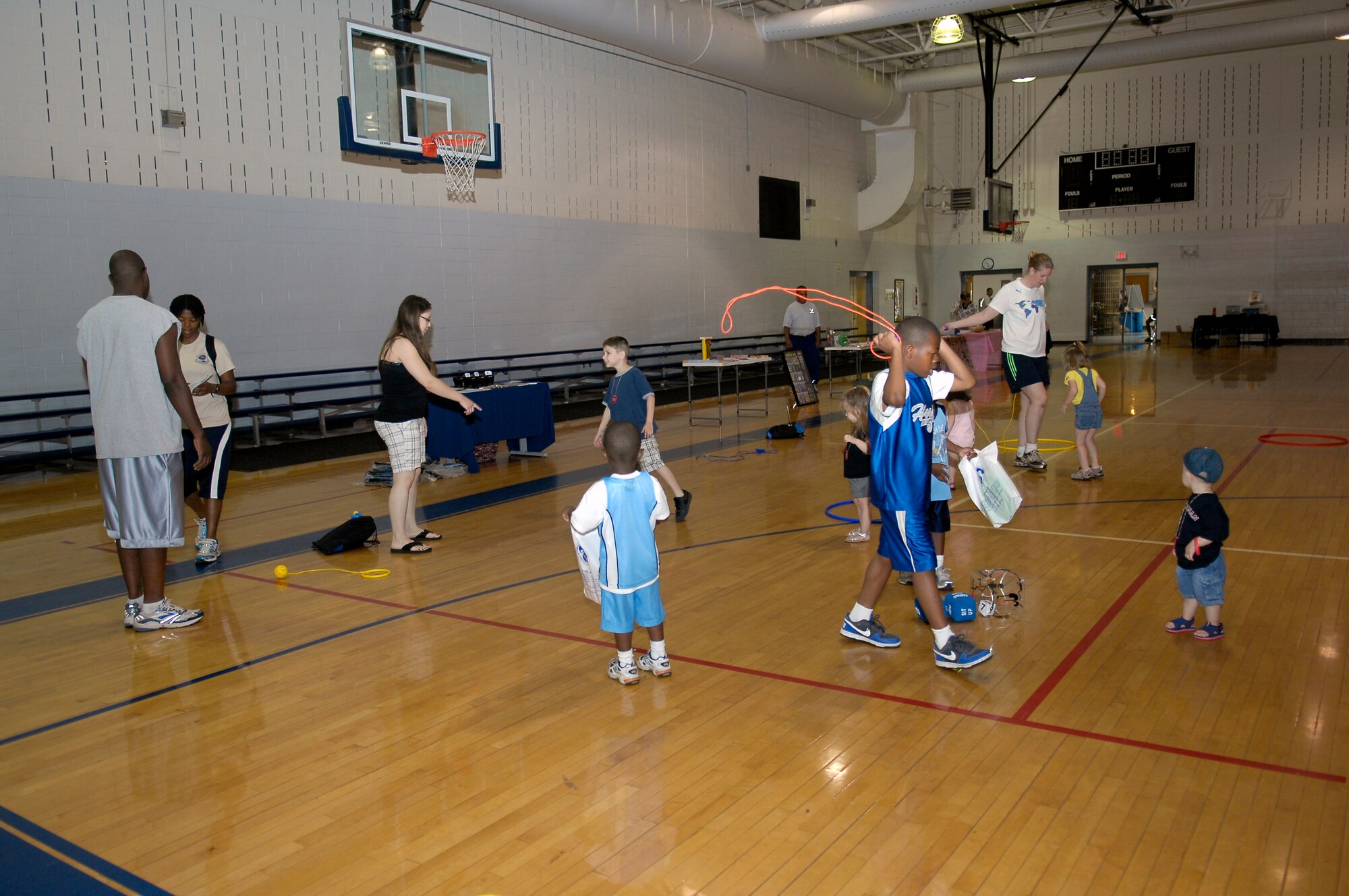 Team Pope members and their families enjoy fitness activities at the Pope Fitness Center during the Fit Family Health Fair on May 8. The fair provided families an opportunity to participate in healthy activities as well as providing pertinent information to maintain an active and healthy lifestyle. (U.S. Air Force photo/Senior Airman Kris Levasseur)