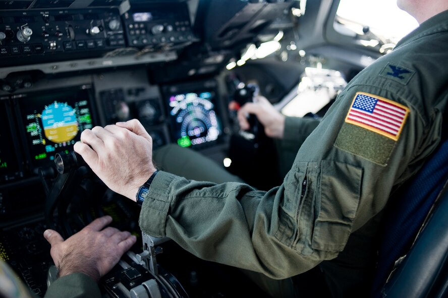 Col. Glenn Rousseau, 62nd Operations Group commander, pilots a C-17 Gobemaster III during an in-flight refueling mission May 12. (U.S. Air Force Photo by Abner Guzman)

