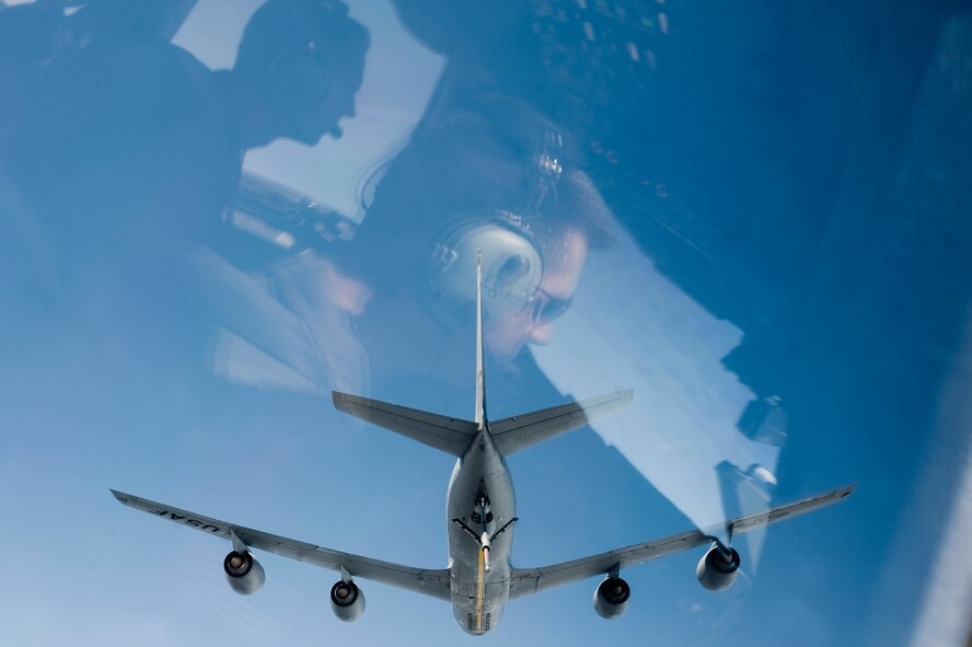 Majs. Joshua Ellis, 62nd Airlift Wing, right, and Capt. Michael Rasinski, 4th Airlift Squadron, prepare to receive fuel from a KC-135 Stratotanker from Fairchild Air Force Base, Wash., during an in-flight refueling mission May 12. (U.S. Air Force Photo by Abner Guzman)


