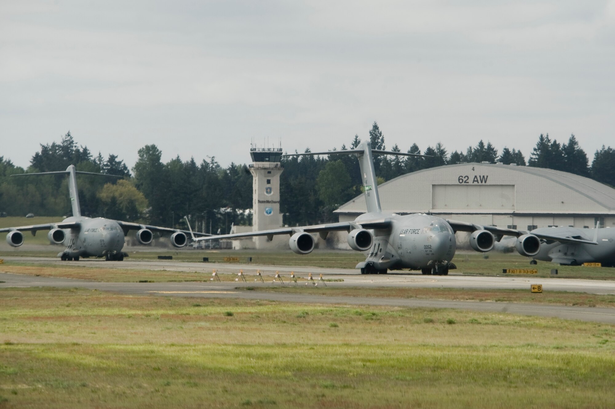 Three C-17 Globemaster III's from McChord Field taxi on the runway here in preparation to launch as part of a large formation exercise May 12. (U.S. Air Force Photo by Abner Guzman)

