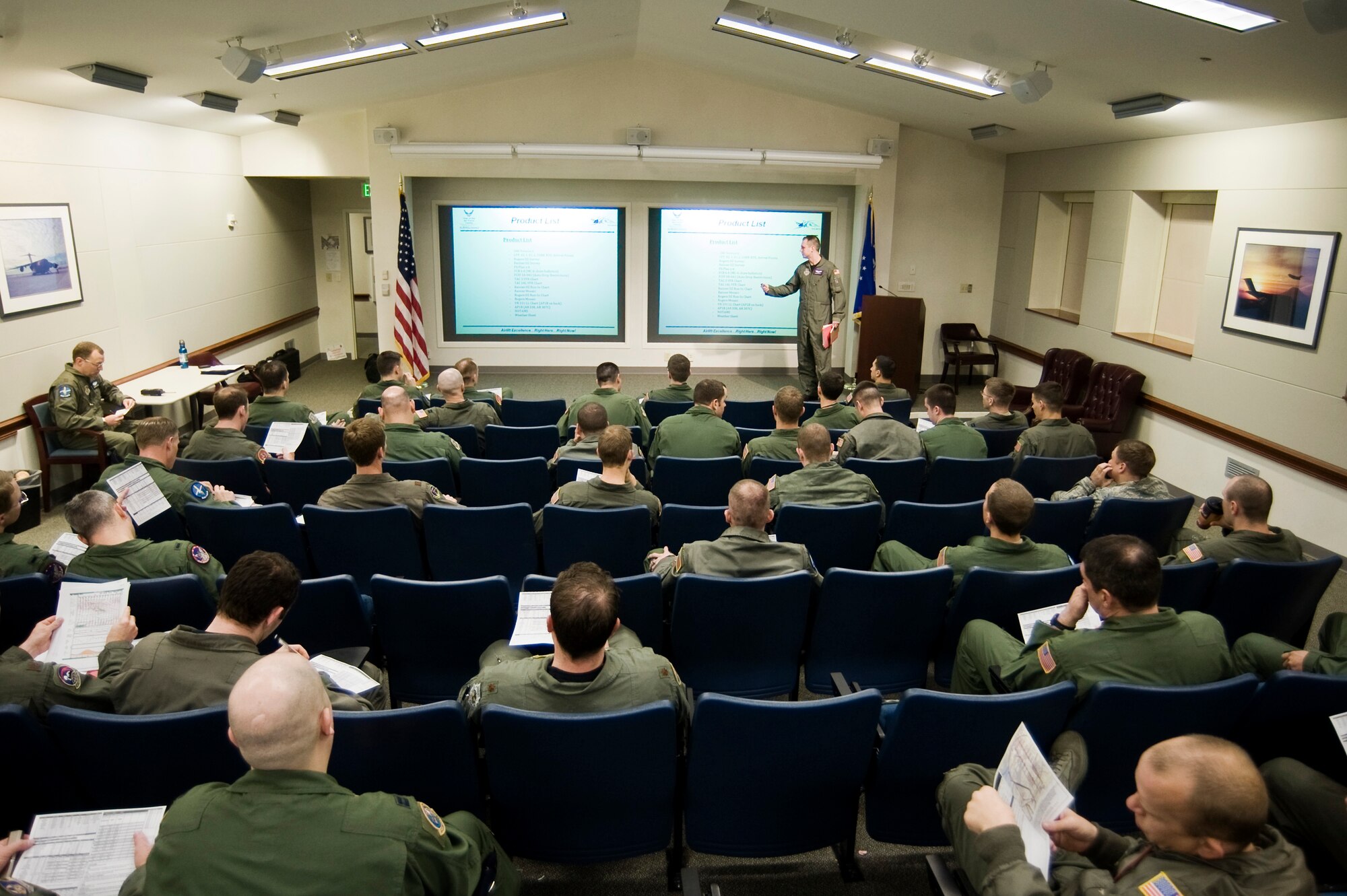 Capt. Michael Rasinski, 4th Airlift Squadron, conducts a pre-flight briefing at the 10th Airlift Squadron auditorium May 12. Aircews participated in a seven-ship formation as  part of a joint requirement to execute Army forcible entry operations by airdropping an entire brigade on short notice.(U.S. Air Force Photo by Abner Guzman)


