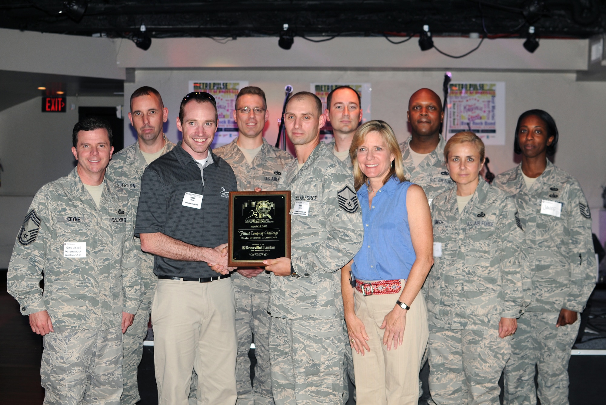 KNOXVILLE, Tenn. -- Servicemembers from The I.G. Brown Air National Guard Training and Education Center, McGhee Tyson ANGB here accept a first place award for the Fittest Company Challenge from the Knoxville Area Chamber Partnership during a ceremony held in Market Square in downtown Knoxville, May 13.  The competition, held March 28 during the Covenant Health Knoxville Marathon, was a friendly contest among area businesses designed to promote a healthy lifestyle and in turn create healthy employees.  (U.S. Air Force photo by Master Sgt. Kurt Skoglund)