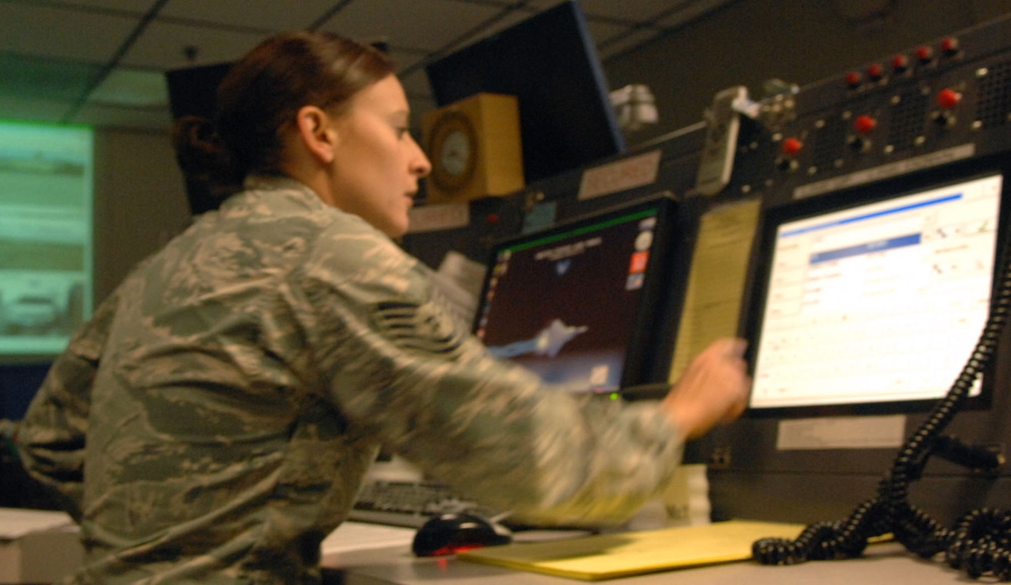 Tech. Sgt. Daniella Benson, senior emergency actions controller, relays information via the command post communication equipment.  Command post controllers are eyes and ears for the commander, and handle situations that could range from domestic disputes to Aircraft crashes.
