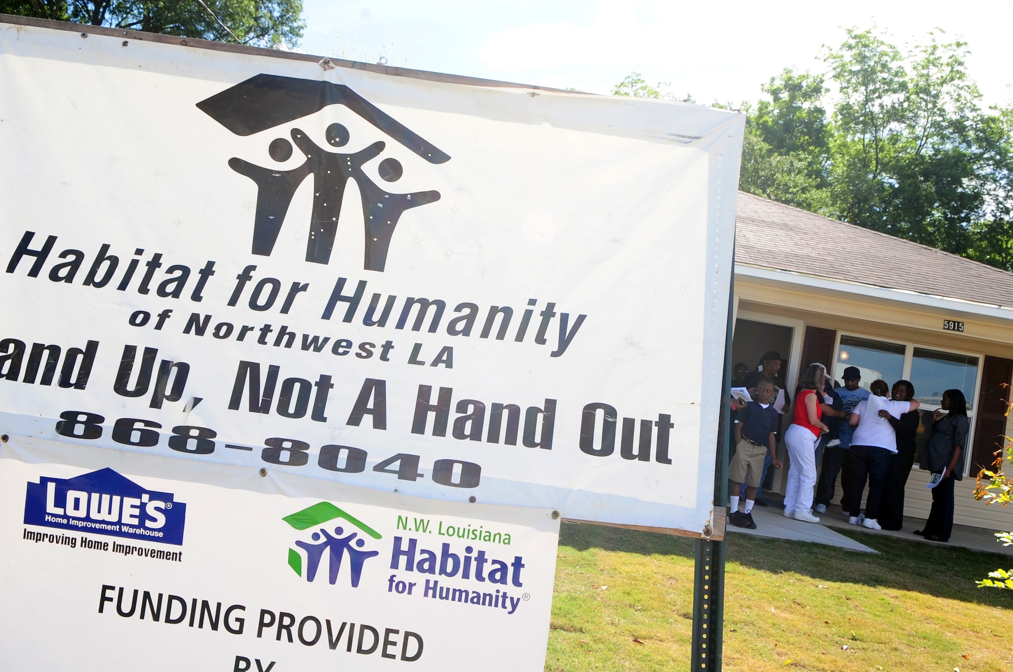 SHREVEPORT, La. – Homeowners Ralph and Michelle Hart welcome guests to their newly constructed home prior to a dedication ceremony May 6. The Hart family was chosen to receive a Habitat for Humanity house after leaving New Orleans following Hurricane Katrina. Over the course of the 22-day construction, more than 100 military personnel from Barksdale Air Force Base and the Shreveport Military Entrance Processing Station volunteered their time to give the Harts a new home. (U.S. Air Force photo by Senior Airman Joanna M. Kresge)